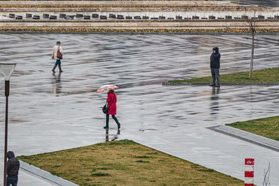 Rear view of men on water