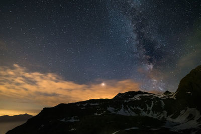 Low angle view of mountain against sky at night