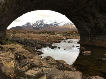 Scenic view of mountains seen from arch