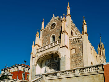 Low angle view of building against blue sky