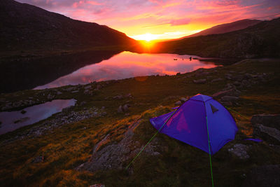 Scenic view of mountains against sky during sunset