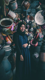 Portrait of smiling woman standing in market