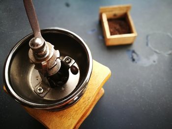 High angle view of metal container on table