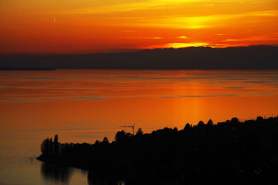 Scenic view of river during sunset