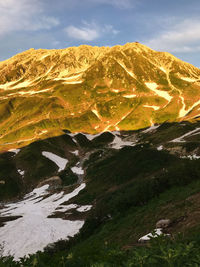 Aerial view of mountain range against sky