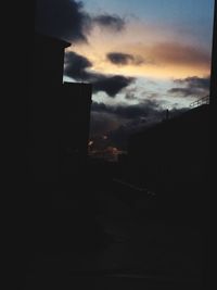 View of buildings against sky at sunset