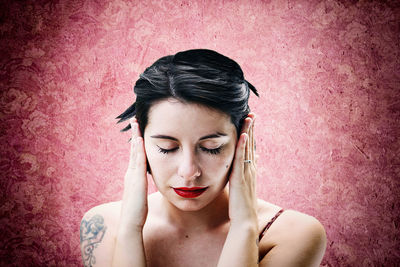 Portrait of beautiful woman with red face