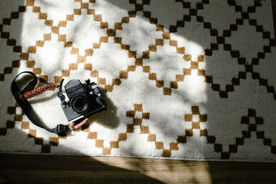 High angle view of camera on carpet at home