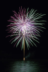 Firework display at night