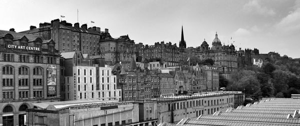 Buildings in city against sky