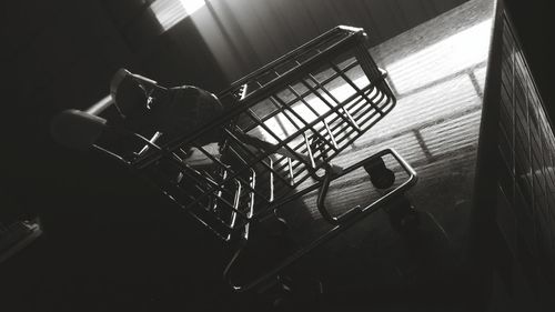 Shopping cart on building terrace at night