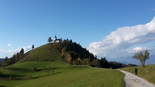 Scenic view of hill against sky