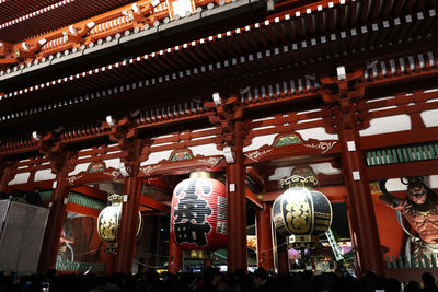 Low angle view of lanterns hanging outside building