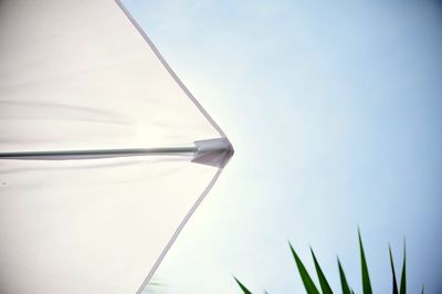 Cropped image of parasol against clear sky