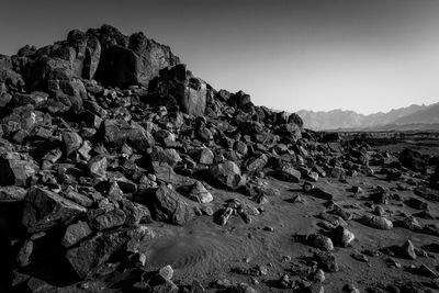 Scenic view of rocks against clear sky