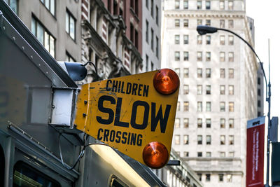 Close-up of road signs in city