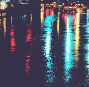 Reflection of illuminated city in water