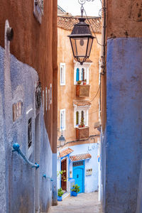 Narrow alley amidst buildings in town