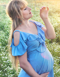 Midsection of young woman with long hair