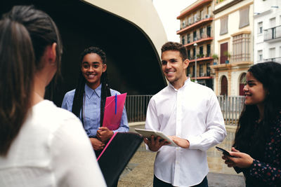 Group of people in front of buildings