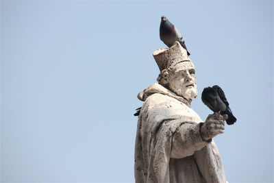 Low angle view of statue against clear sky
