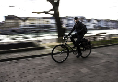 Man cycling on road