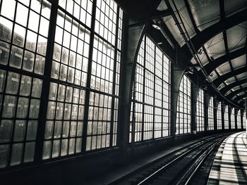 Railroad station platform seen through glass window