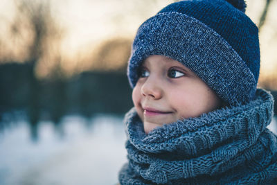 Close-up portrait of girl in snow