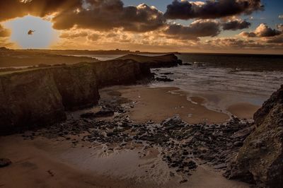 Scenic view of sea at sunset