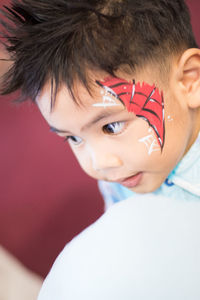 Close-up portrait of smiling boy
