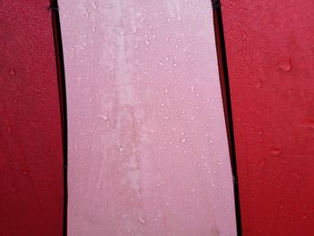 Full frame shot of water on red wall