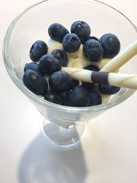 High angle view of grapes in bowl on table