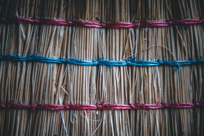 Close-up of rope tied on wood