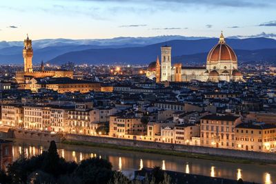 Duomo santa maria del fiore amidst cityscape at dusk