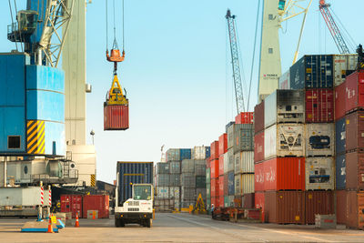 View of commercial dock against sky in city