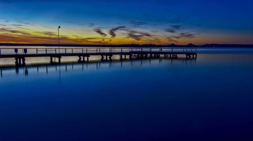 Scenic view of sea against sky at sunset