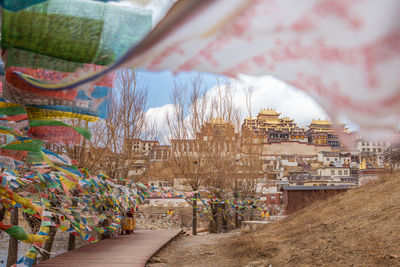 Prayer flags against buildings