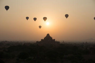 Hot air balloon in sky at sunset