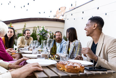 Female friends having food at table