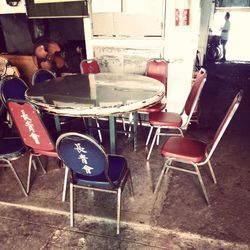 Empty chairs and tables in cafe