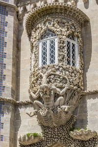 Low angle view of statue against building