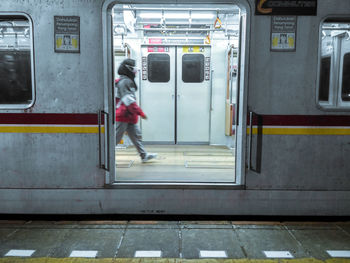 Full length of man standing at railroad station