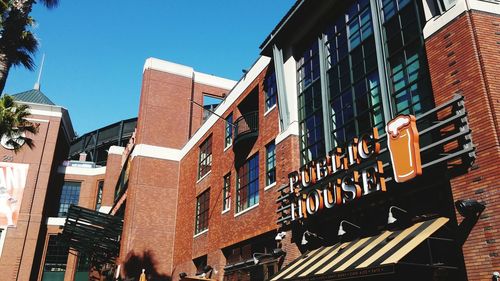 Low angle view of building against clear blue sky