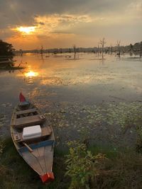 Scenic view of lake against sky during sunset