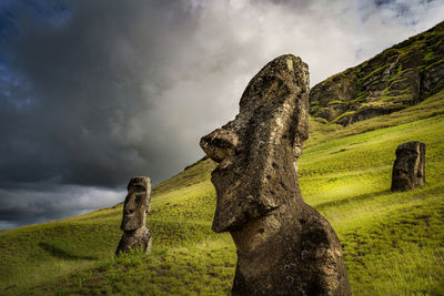 Old ruins on field against sky