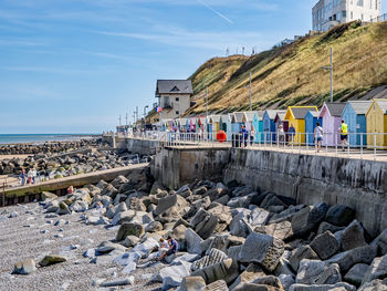  beach huts on sheringham promenade over looking the sandy beach and north sea beyond