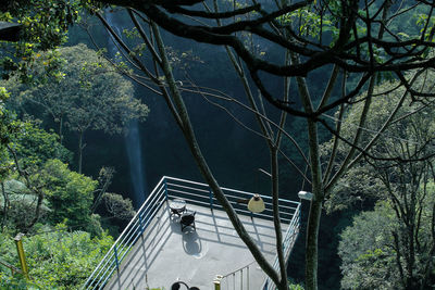 High angle view of bridge amidst trees in forest