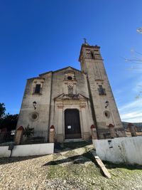 Low angle view of building against clear blue sky