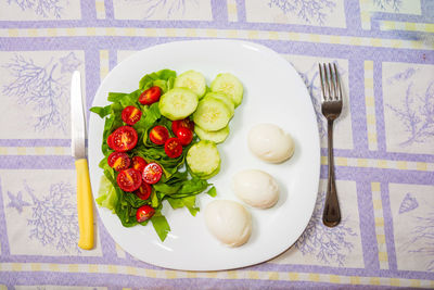 High angle view of fruits in plate on table