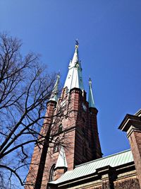 Low angle view of church against clear blue sky